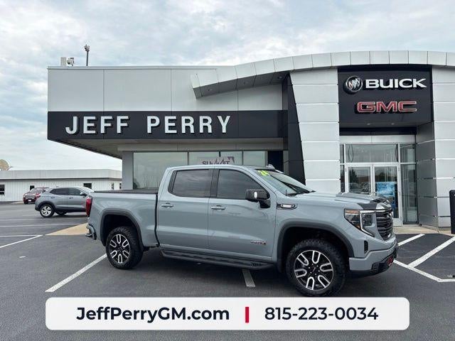 2024 GMC Sierra 1500 AT4 in Thunderstorm Gray — front three-quarter view